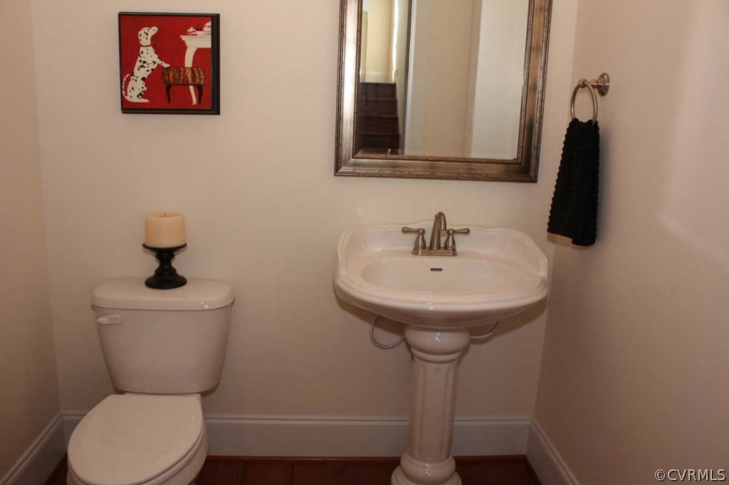 3324 Handley Road Midlothian, VA 23113 - Photo 22 of 24 a bathroom with a toilet a sink and a mirror
