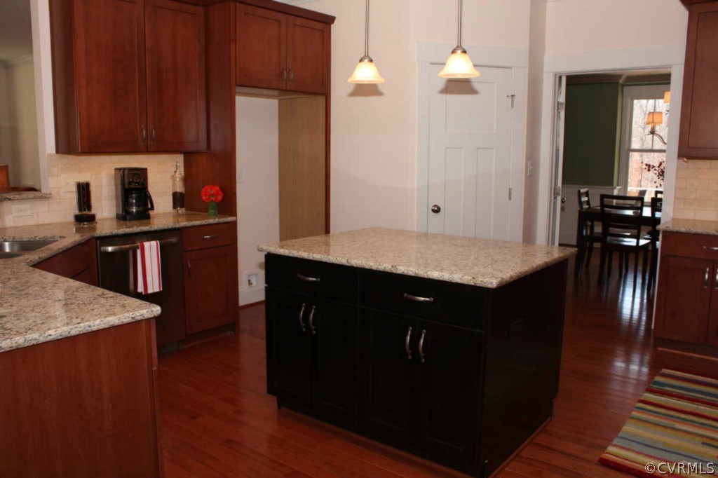 3324 Handley Road Midlothian, VA 23113 - Photo 5 of 24 a kitchen with stainless steel appliances granite countertop wooden cabinets a refrigerator a sink a stove and wooden floors