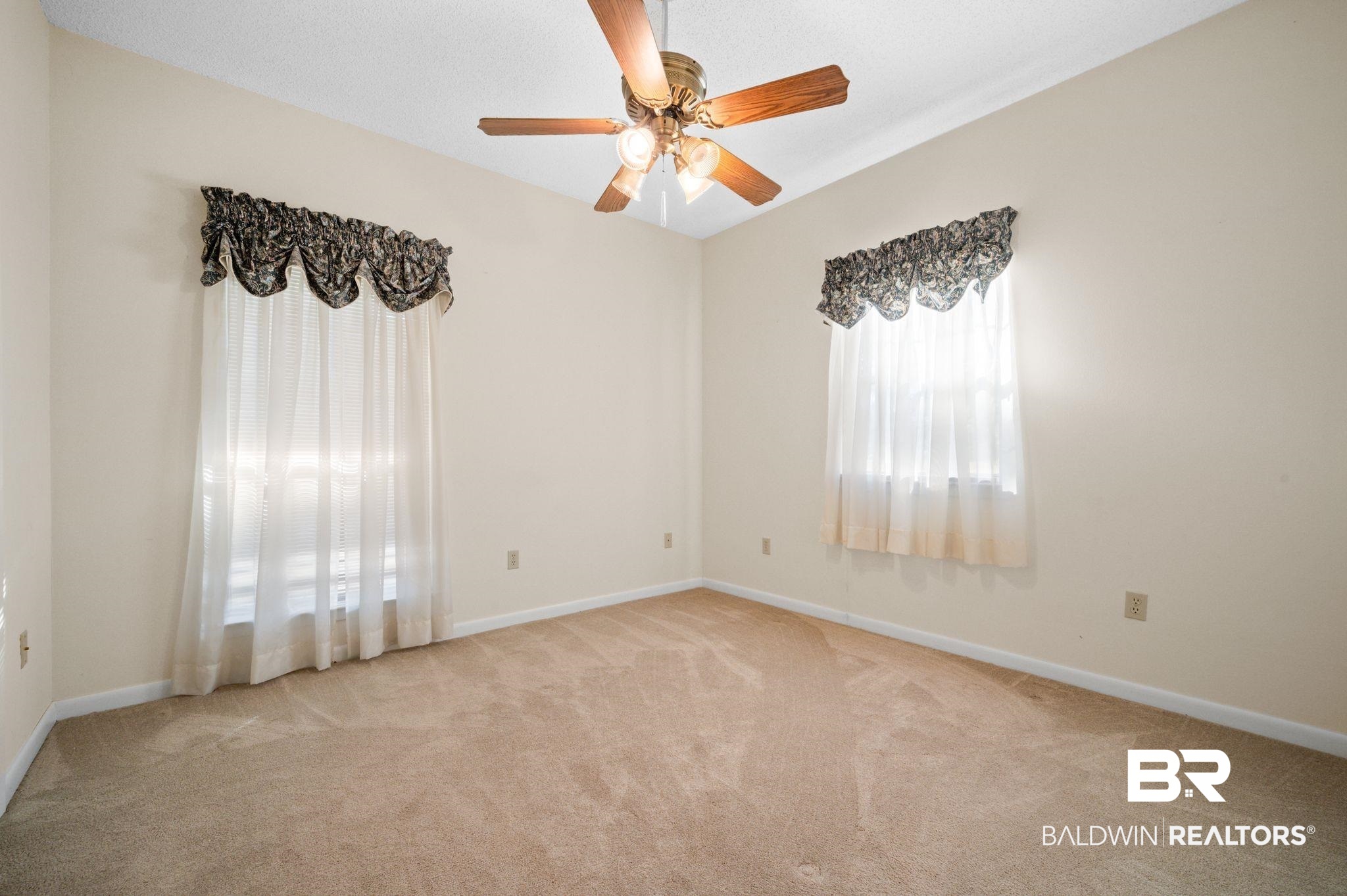 15801 Maytower Road Bay Minette, AL 36507 - Photo 22 of 43 Empty room with light carpet and ceiling fan