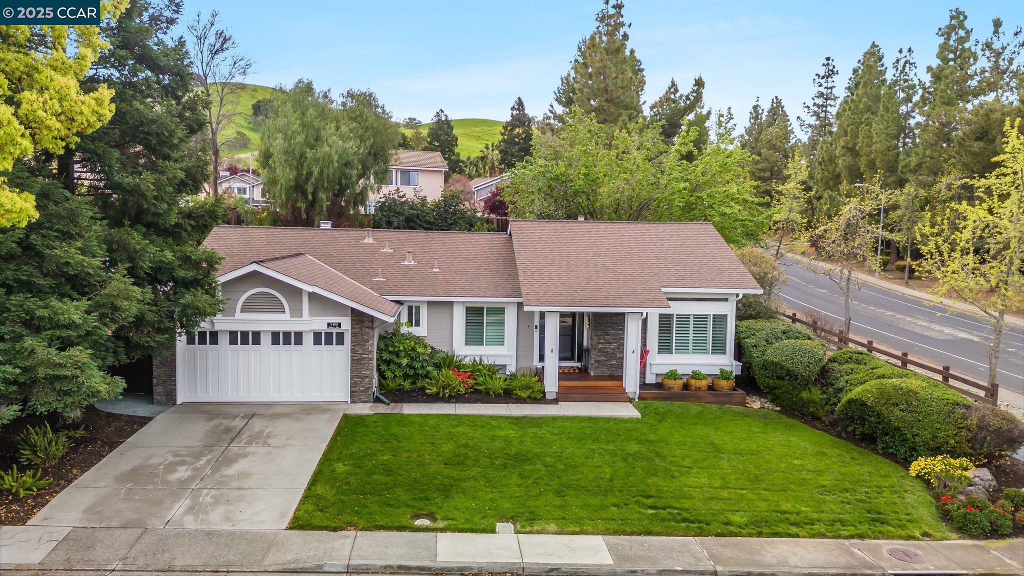 front view of a house with a yard