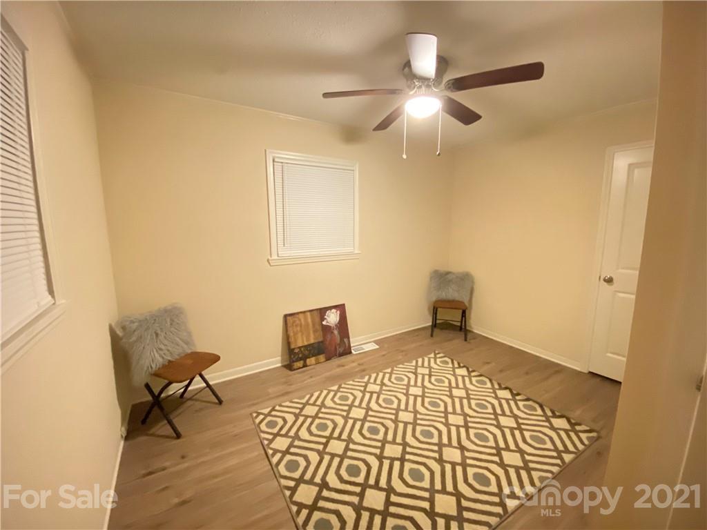 807 Park Road Dallas, NC 28034 - Photo 4 of 8 a bedroom with a bed and a table