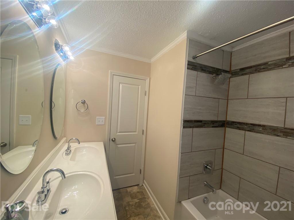 807 Park Road Dallas, NC 28034 - Photo 6 of 8 a bathroom with a sink toilet and shower