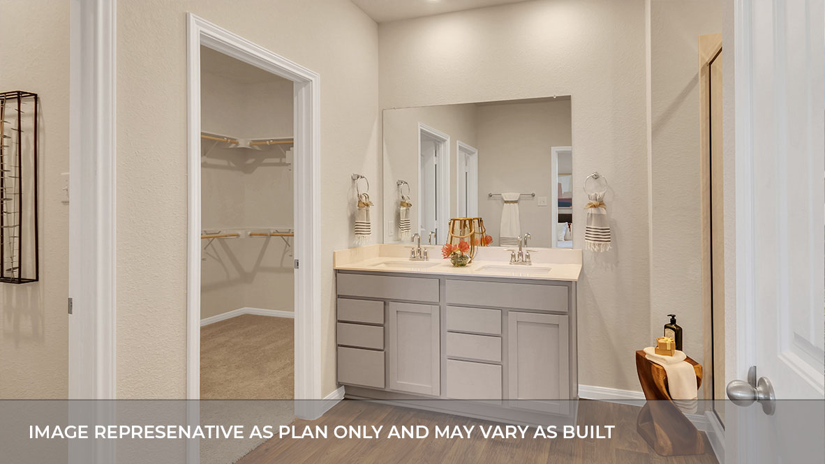 183 Balmorhea Street Kyle, TX 78640 - Photo 26 of 34 a bathroom with a sink a mirror and a shower