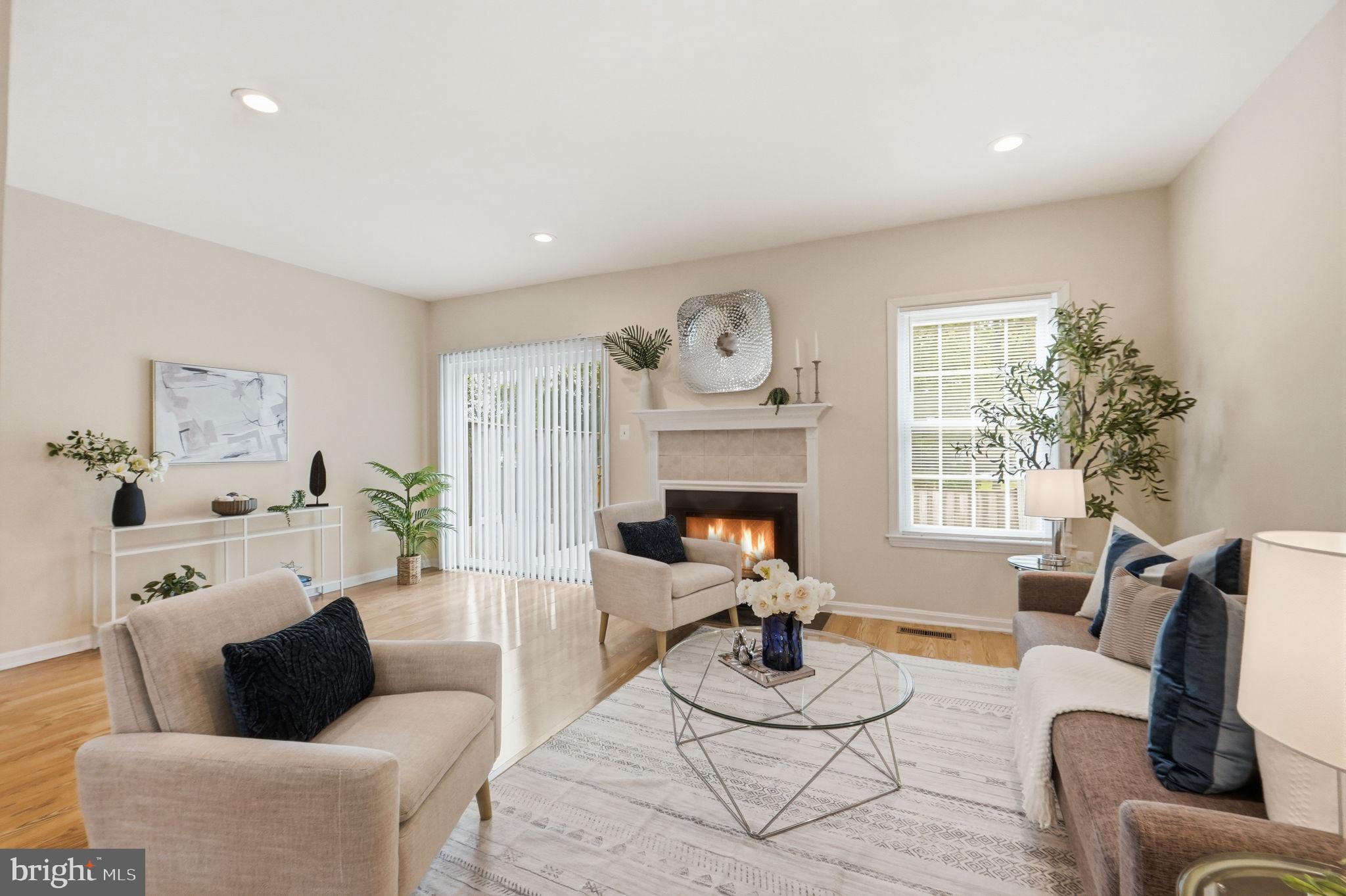 6470 Franconia Court Springfield, VA 22150 - Photo 2 of 31 a living room with furniture and a fireplace