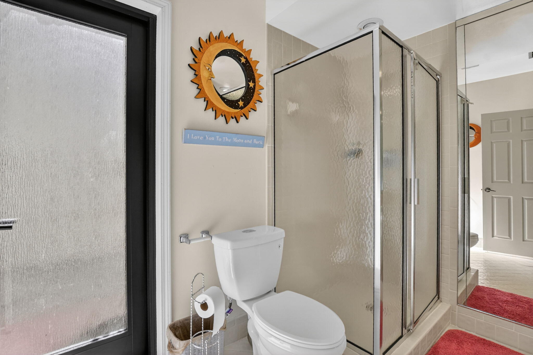 22519 Esplanada Circle, Unit W Boca Raton, FL 33433 - Photo 46 of 57 a bathroom with a toilet and a shower curtain