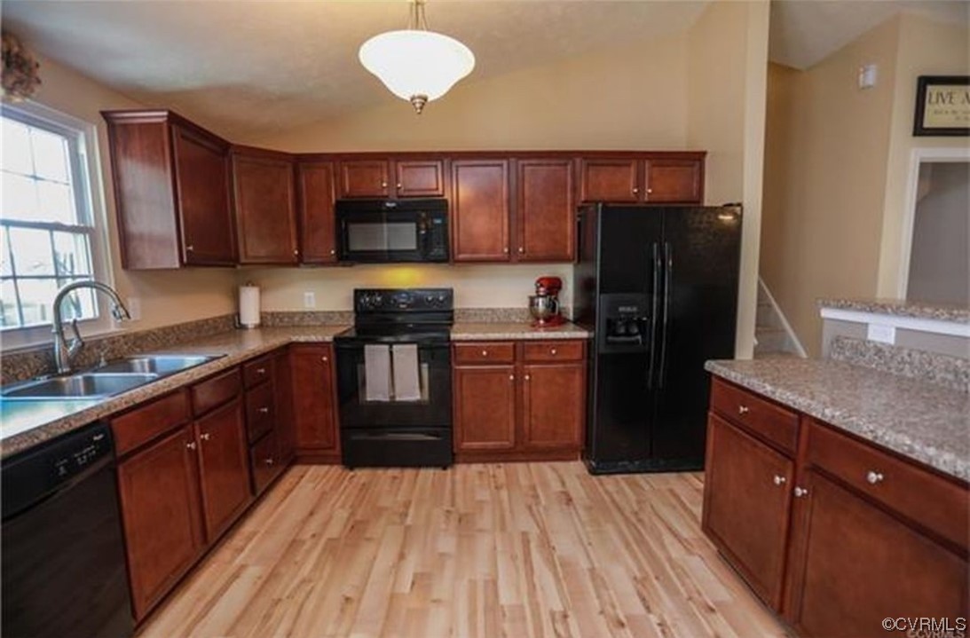 6417 Oldbern Road Chesterfield, VA 23832 - Photo 3 of 17 a kitchen with stainless steel appliances granite countertop a refrigerator a sink dishwasher a stove with wooden cabinets and floor