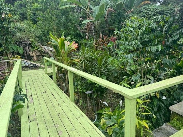 a view of balcony with wooden floor