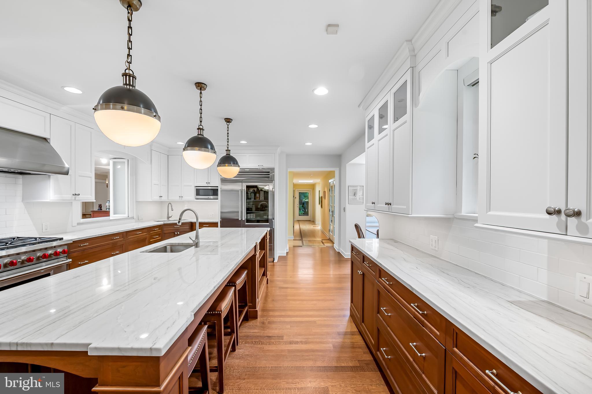 6 Meadow Road Baltimore, MD 21212 - Photo 12 of 53 a large kitchen with kitchen island a large counter space a sink appliances and cabinets