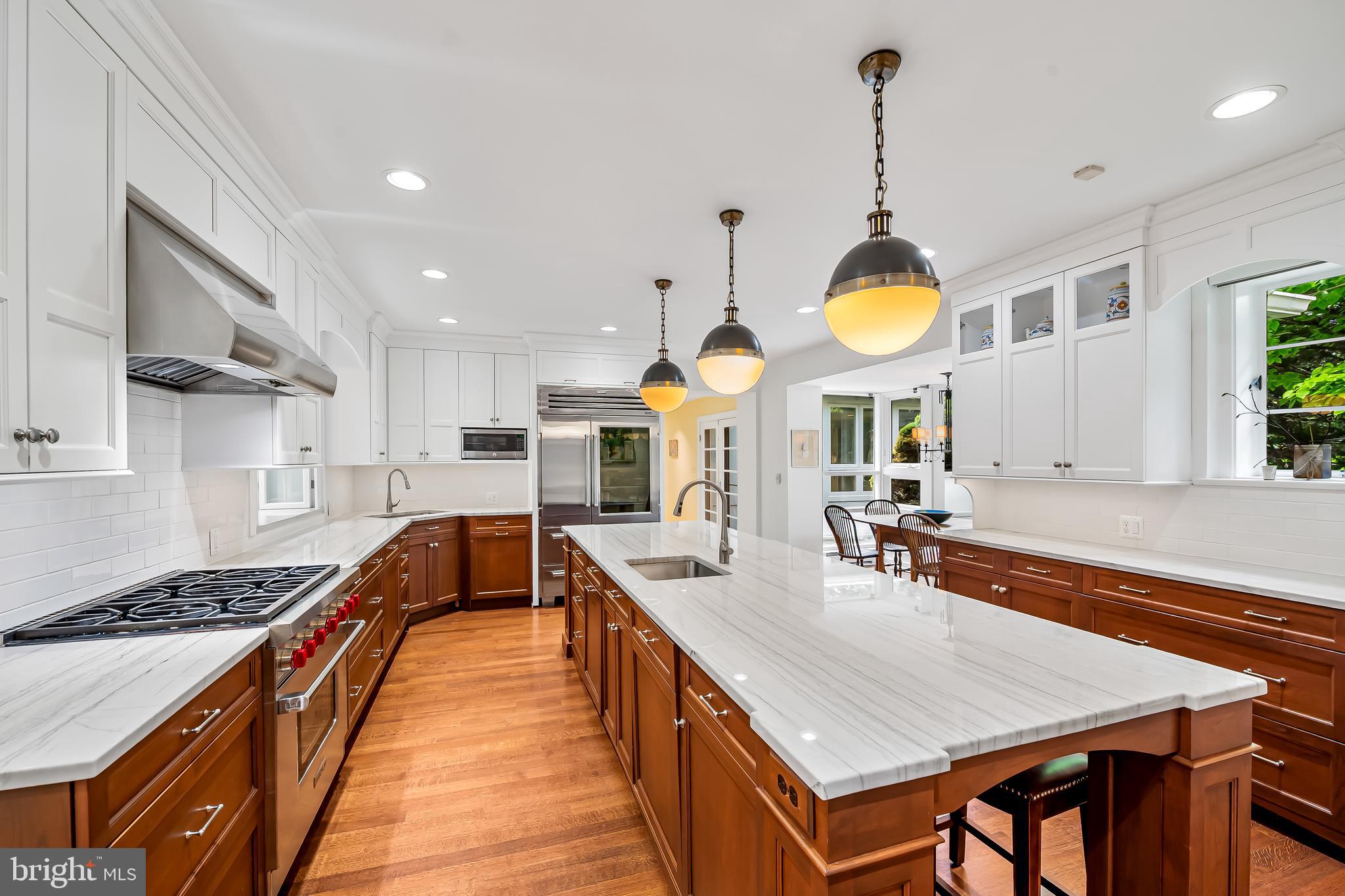 6 Meadow Road Baltimore, MD 21212 - Photo 14 of 53 a kitchen with stainless steel appliances granite countertop a stove a sink a oven a dining table and chairs