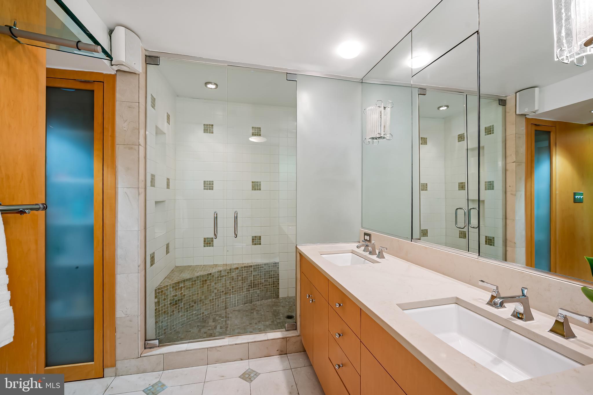 6 Meadow Road Baltimore, MD 21212 - Photo 32 of 53 a bathroom with a shower sink and mirror