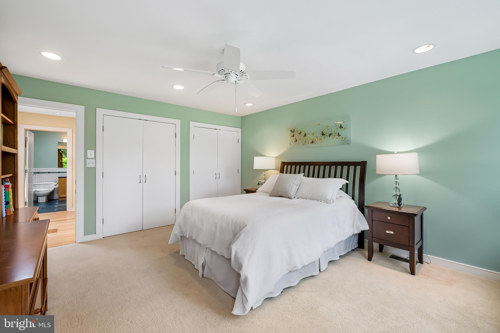 6 Meadow Road Baltimore, MD 21212 - Photo 34 of 53 a spacious bedroom with a bed and a lamp