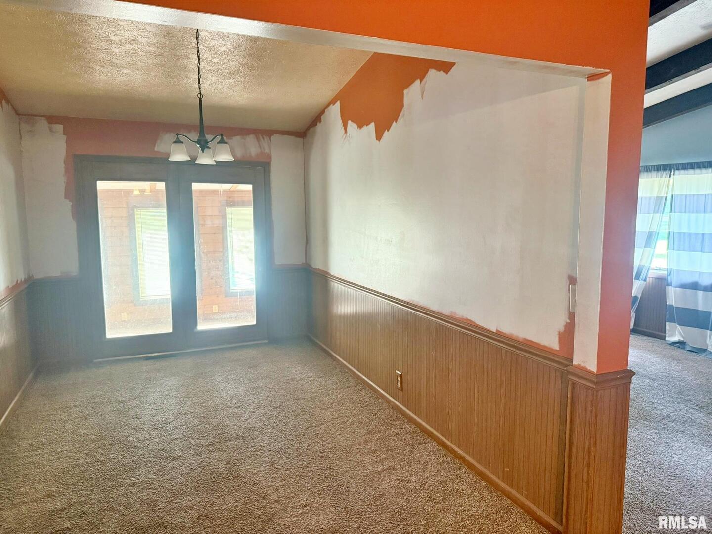 24 Adkins Street Metropolis, IL 62960 - Photo 11 of 23 a view of hallway with windows and chandelier