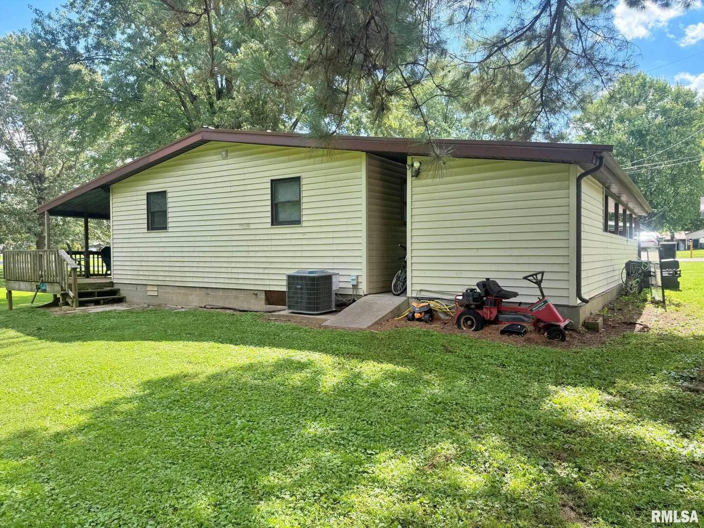 24 Adkins Street Metropolis, IL 62960 - Photo 3 of 23 a view of a house with a backyard