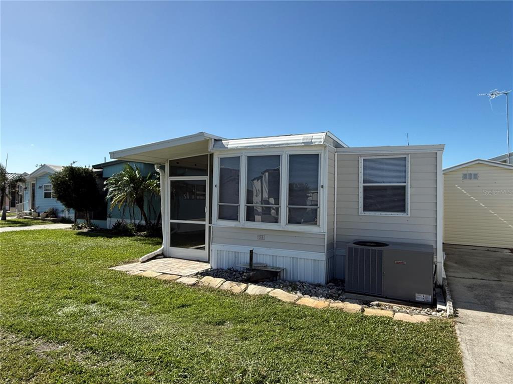 a view of house with backyard