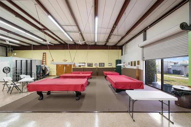 a bedroom with furniture and a chandelier