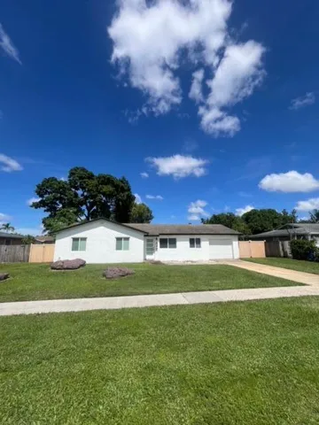 a view of a house with a big yard