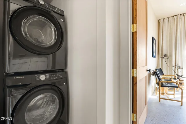 a bedroom with a large bed and a large window