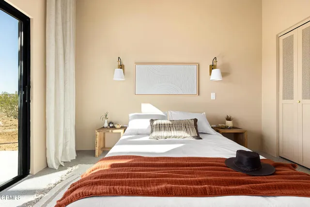 a living room with a couch and a window