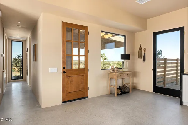 a kitchen with a table and chairs in it