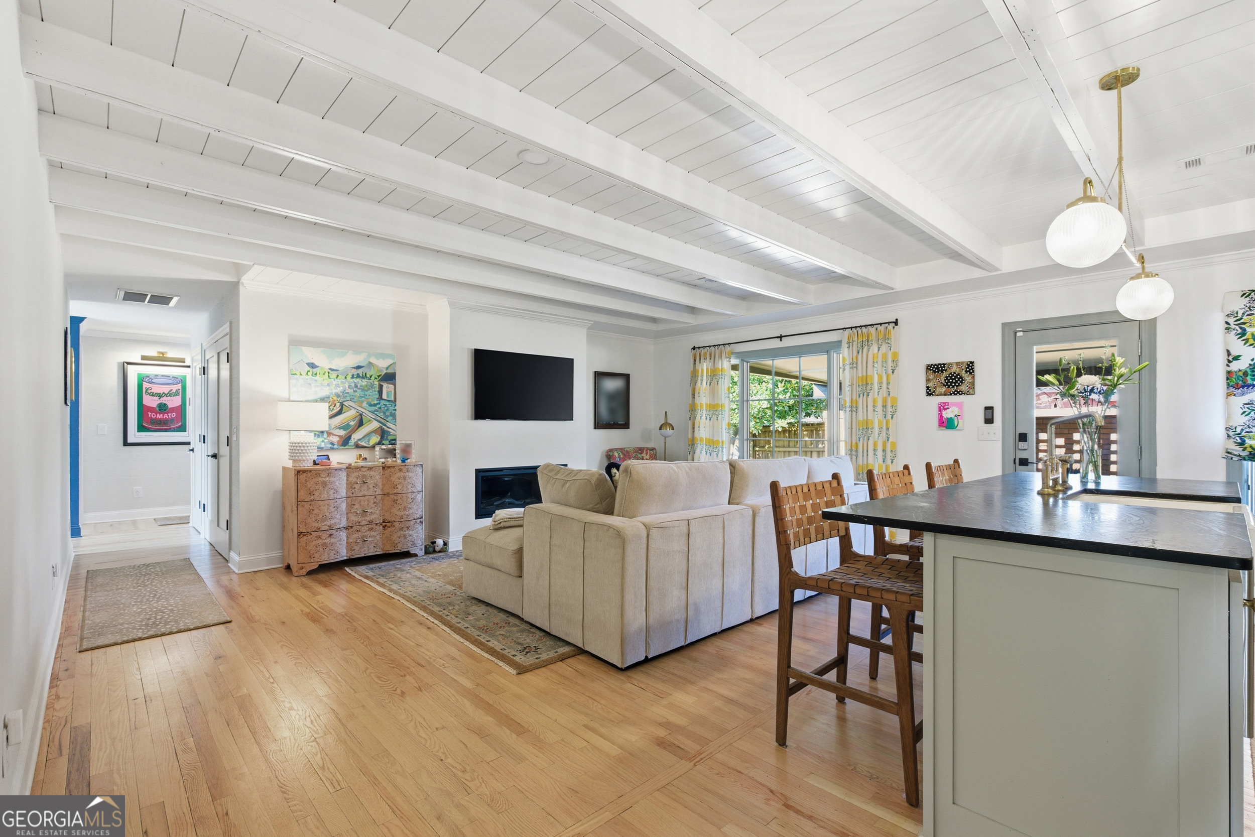 125 Maple Street Cornelia, GA 30531 - Photo 11 of 44 a living room with furniture a flat screen tv and a large window