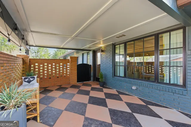 a room with a black white checkered floor with a black white checkered floor