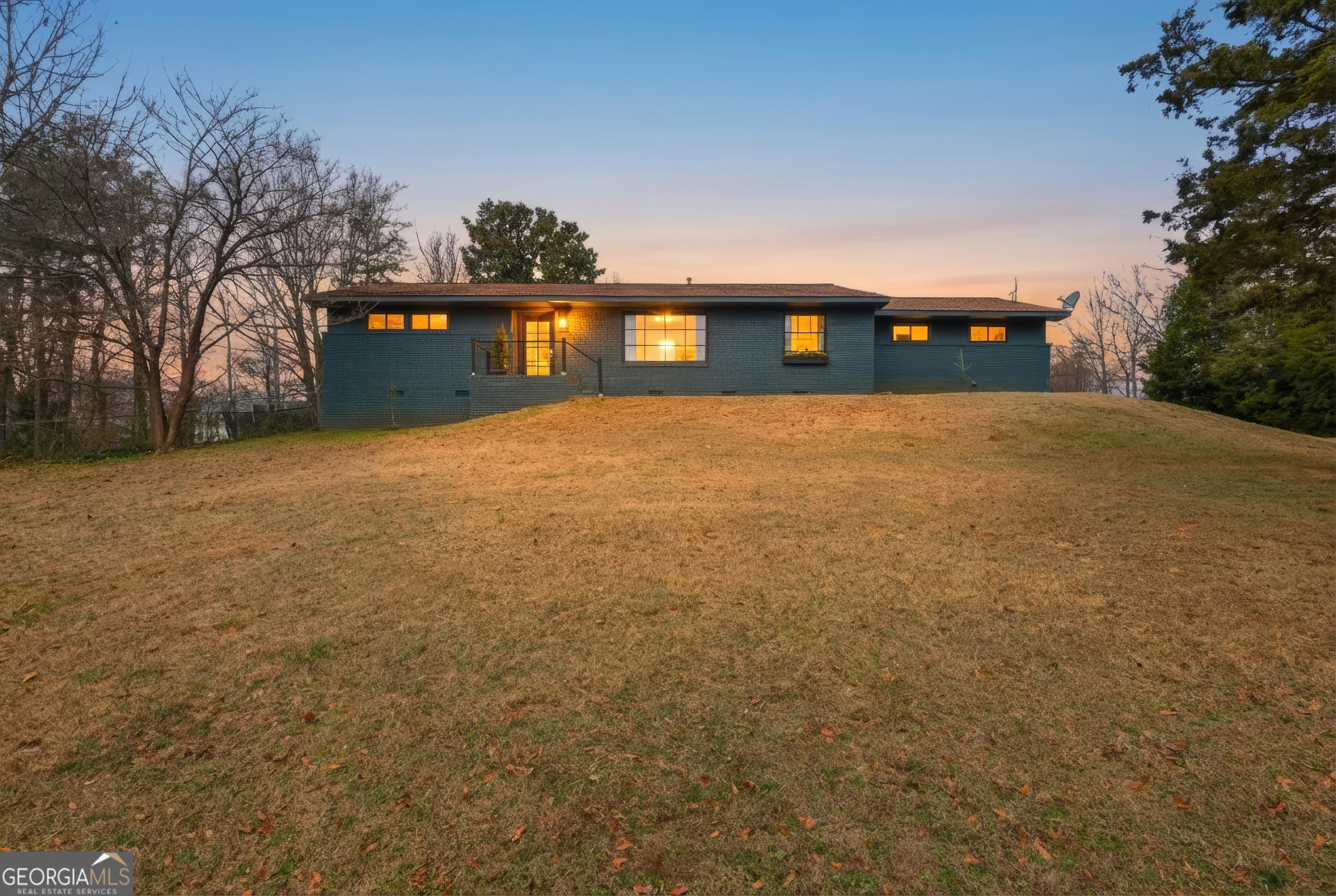 125 Maple Street Cornelia, GA 30531 - Photo 2 of 44 a view of a big yard with an outdoor space