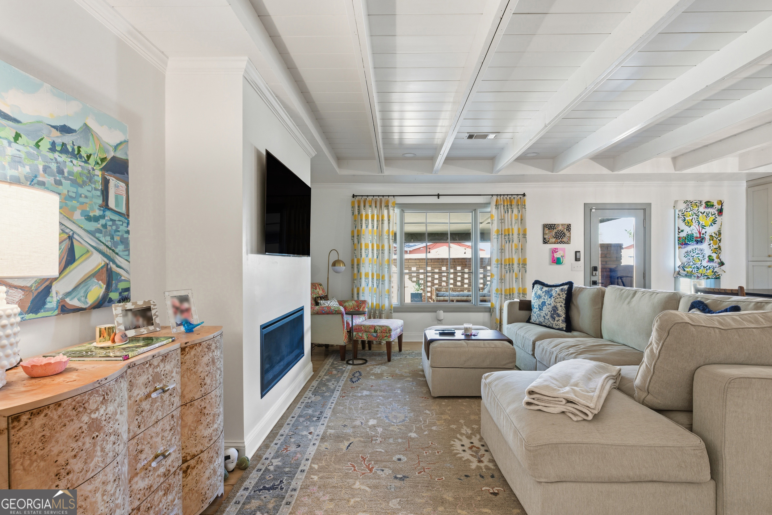 125 Maple Street Cornelia, GA 30531 - Photo 21 of 44 a living room with furniture and a flat screen tv