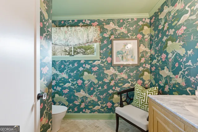 a bedroom with furniture and a flat screen tv