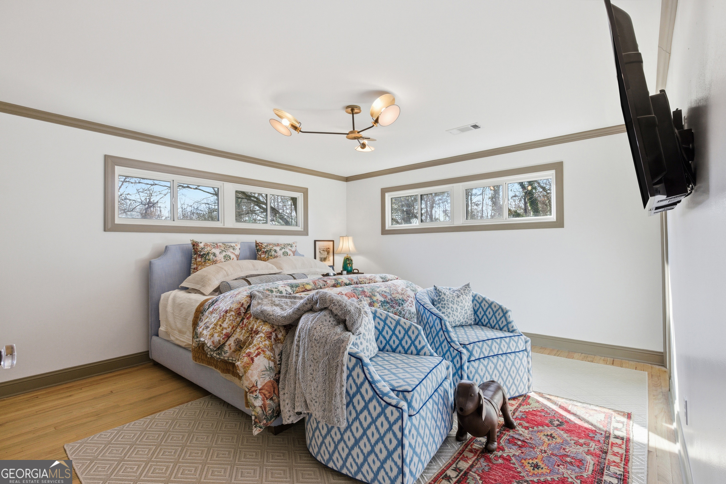 125 Maple Street Cornelia, GA 30531 - Photo 25 of 44 a bedroom with furniture and a flat screen tv