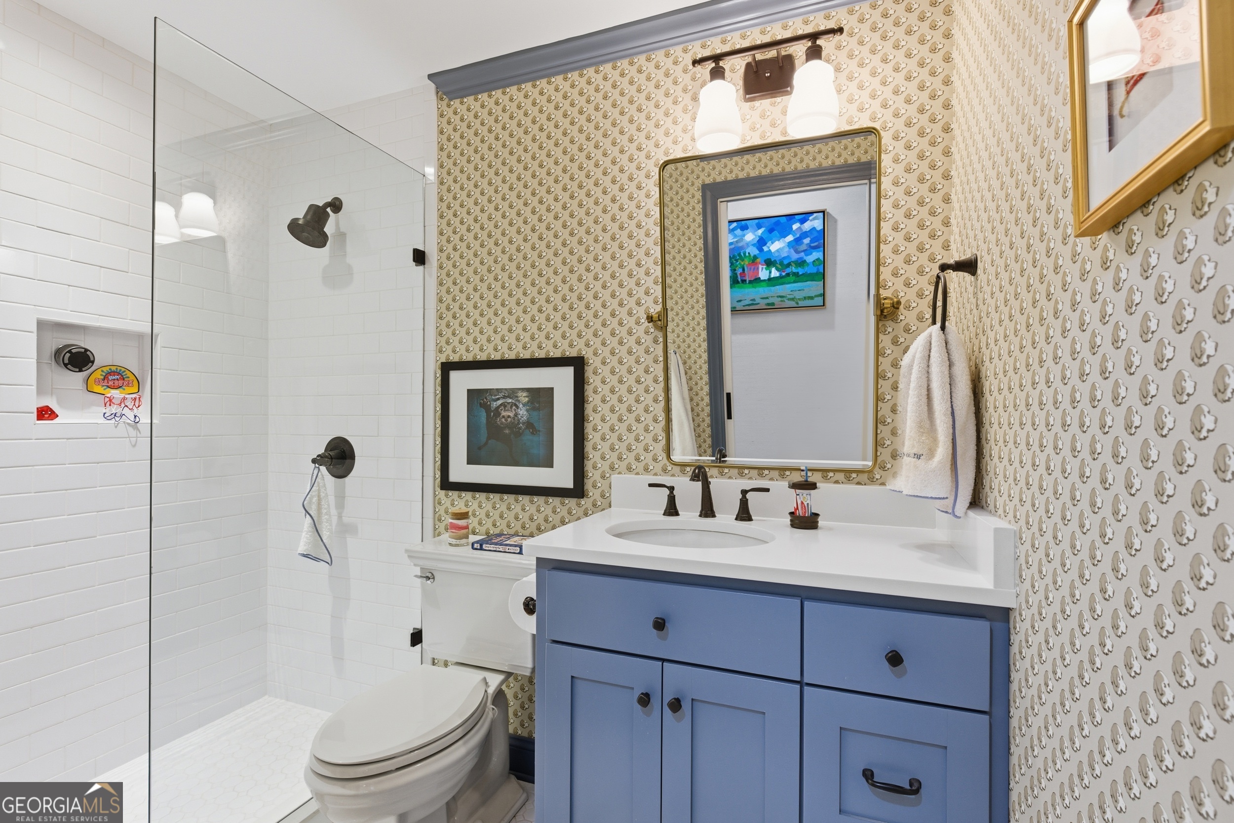 125 Maple Street Cornelia, GA 30531 - Photo 32 of 44 a bathroom with a sink a toilet and shower