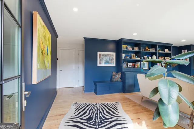 a bedroom with a bed and a bookshelf