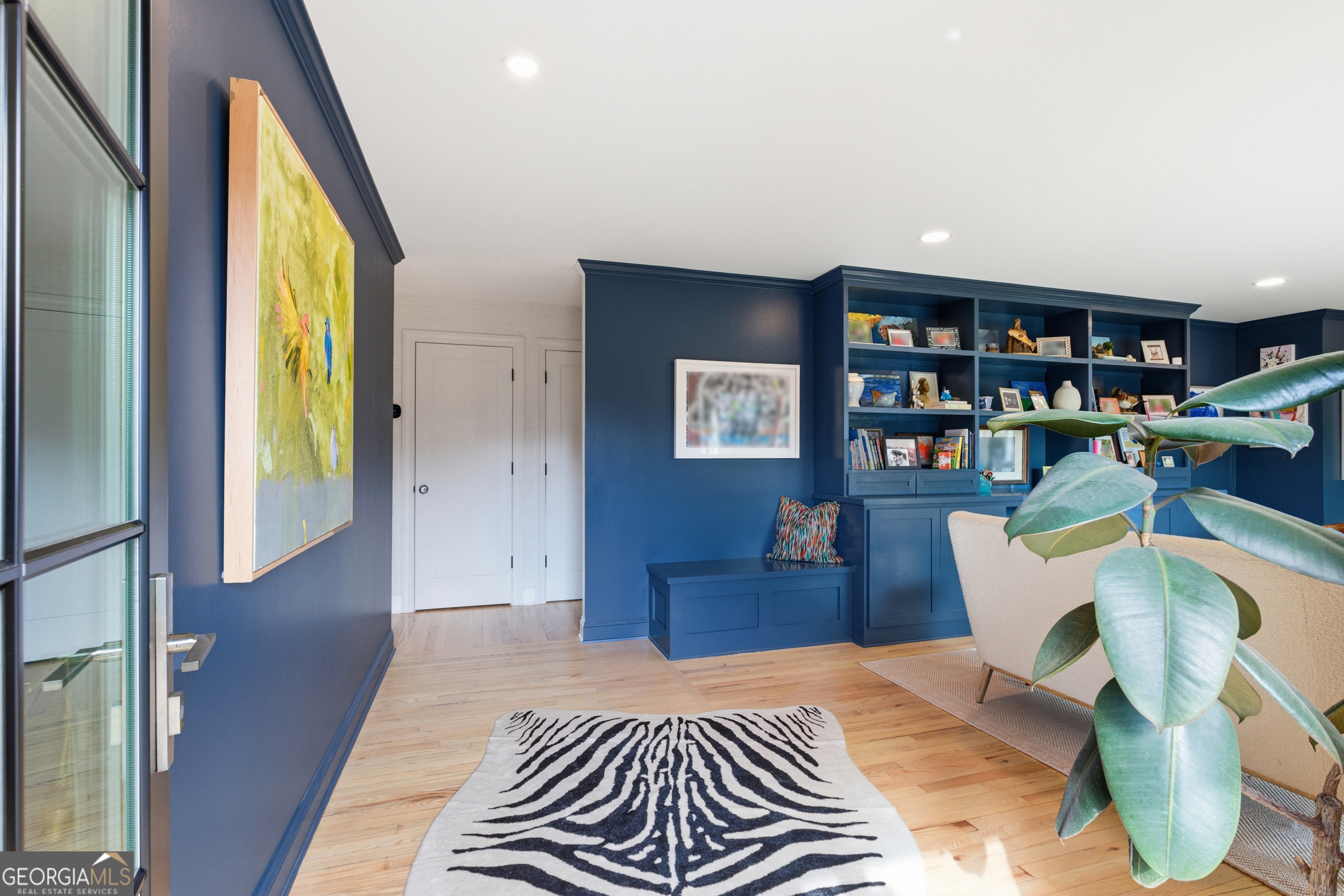 125 Maple Street Cornelia, GA 30531 - Photo 4 of 44 a bedroom with a bed and a bookshelf