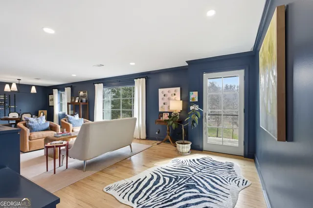 a bedroom with furniture and a window