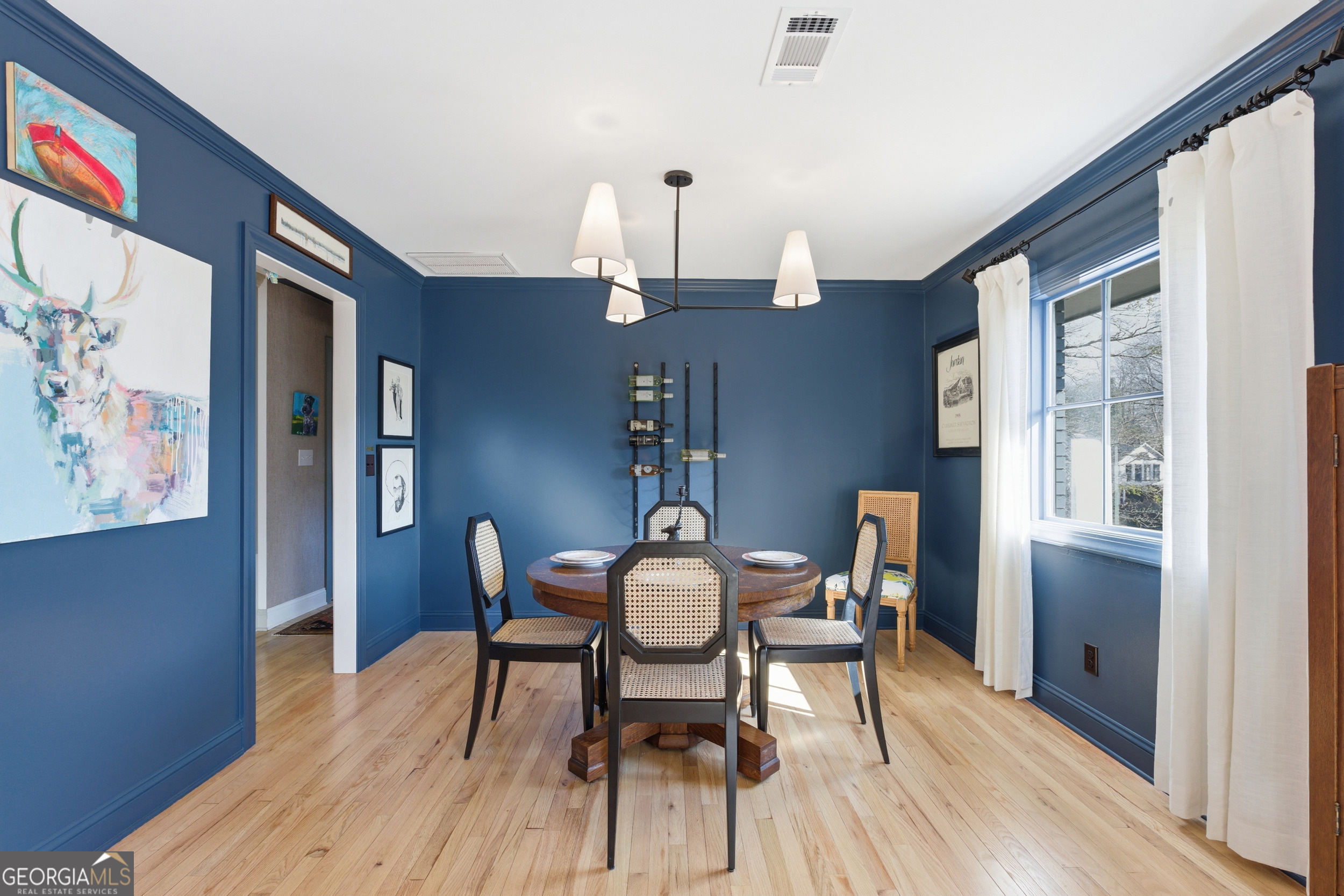 125 Maple Street Cornelia, GA 30531 - Photo 9 of 44 a view of a dining room with furniture and wooden floor