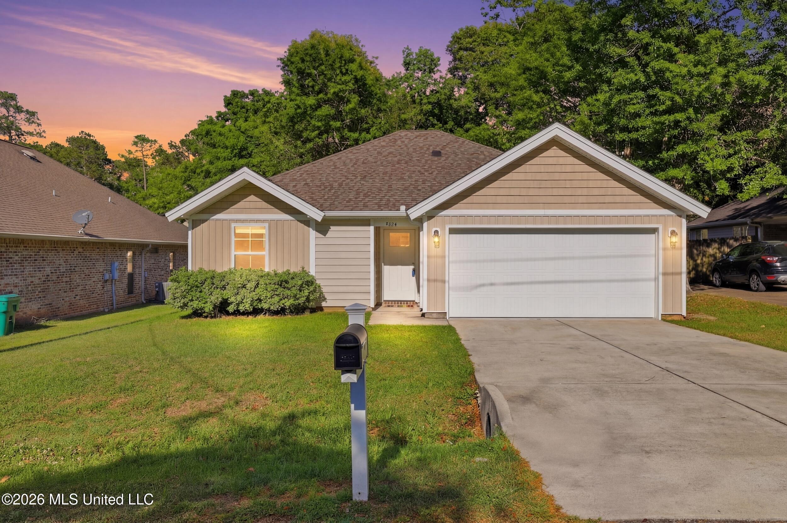 9826 Ala Moana Street Diamondhead, MS 39525 - Photo 2 of 44 1_r6__2305_twilight_d95e3804