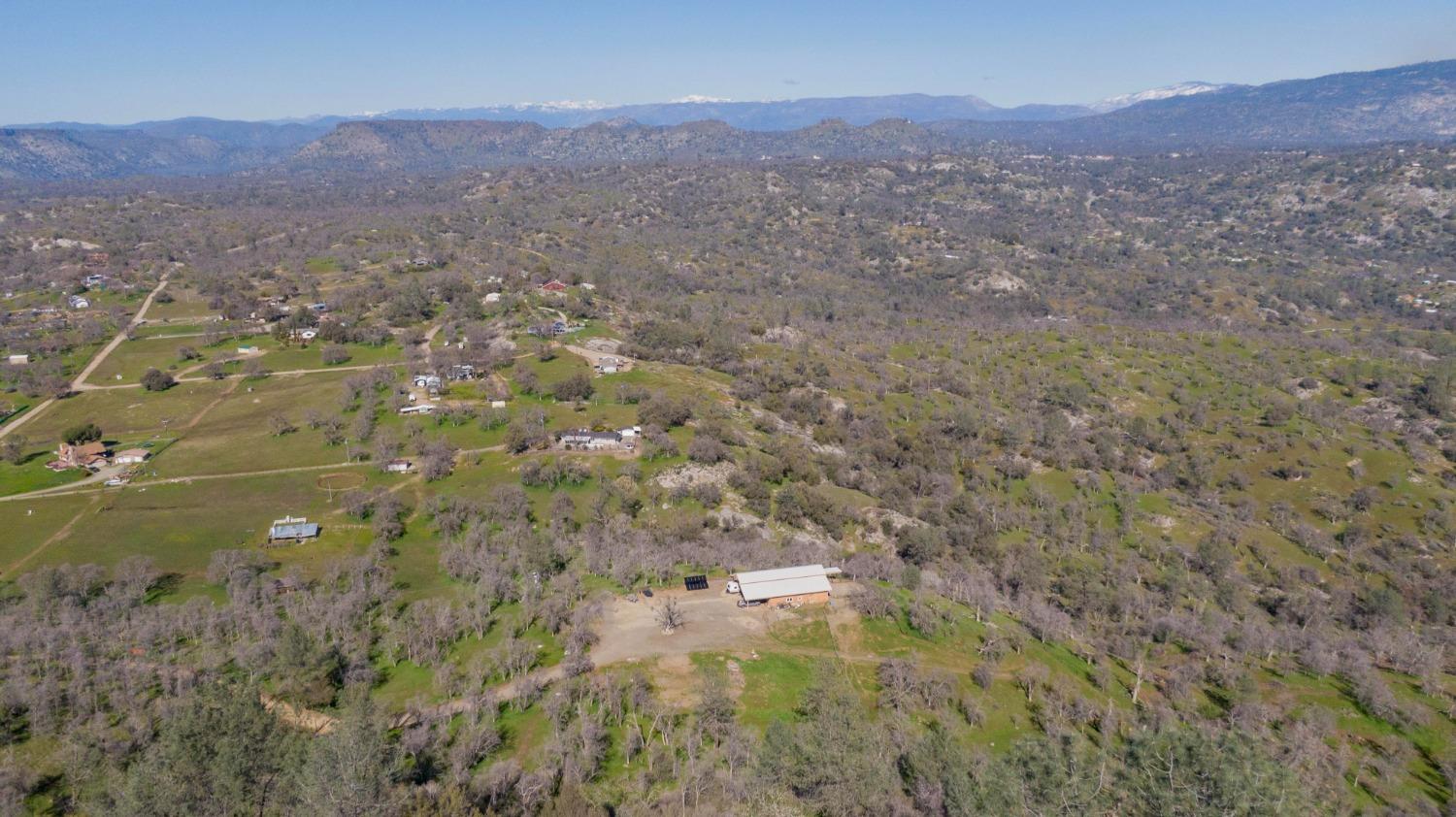 0 Apn Road, Unit 13836007 Clovis, CA 93619 - Photo 56 of 65 a view of a lush green hillside and a mountain