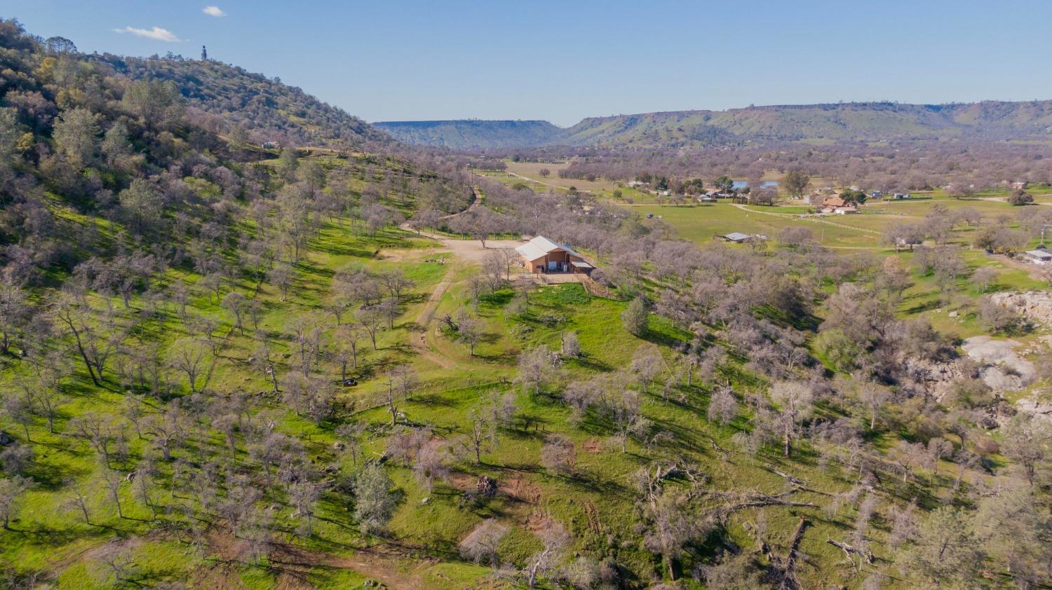 0 Apn Road, Unit 13836007 Clovis, CA 93619 - Photo 58 of 65 a view of a lush green hillside and houses