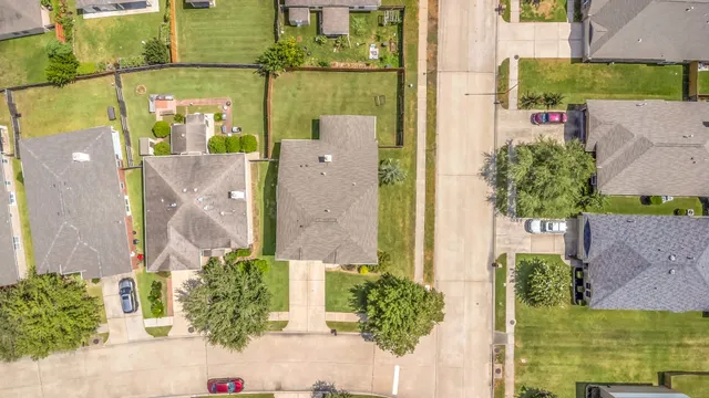 aerial view of a house with a garden