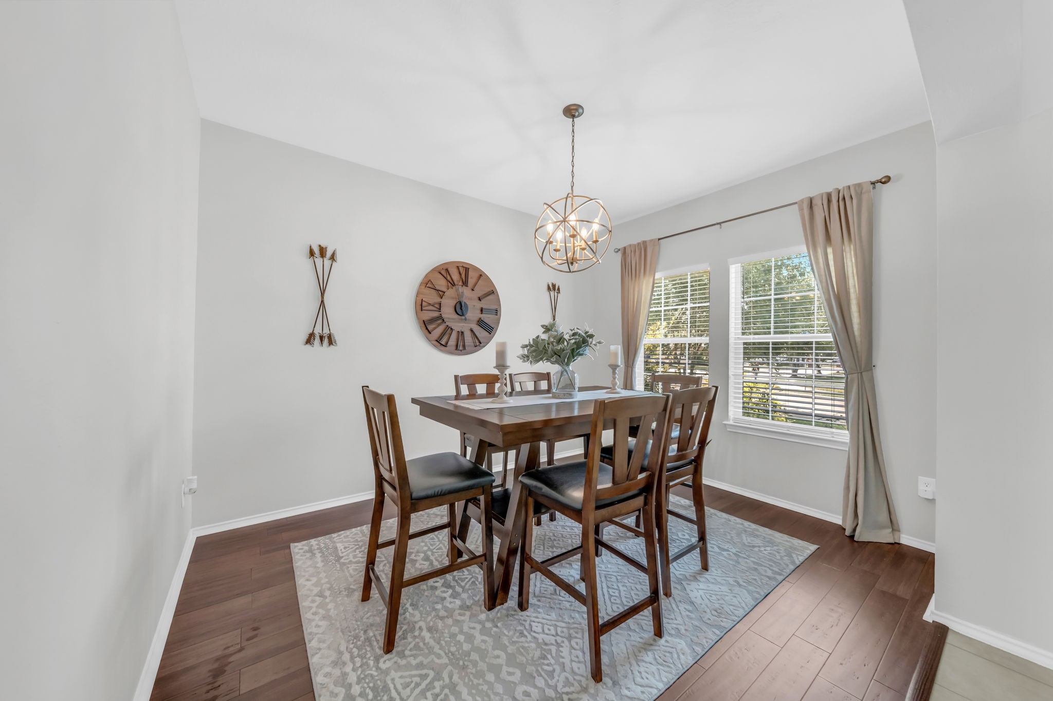 4502 Baron Road Baytown, TX 77521 - Photo 4 of 25 a view of a dining room with furniture window and wooden floor