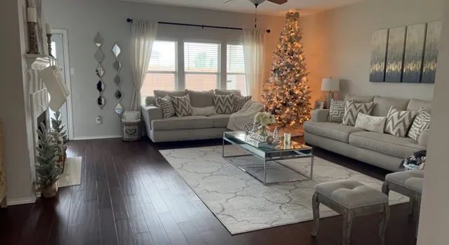 a living room with furniture and a large window