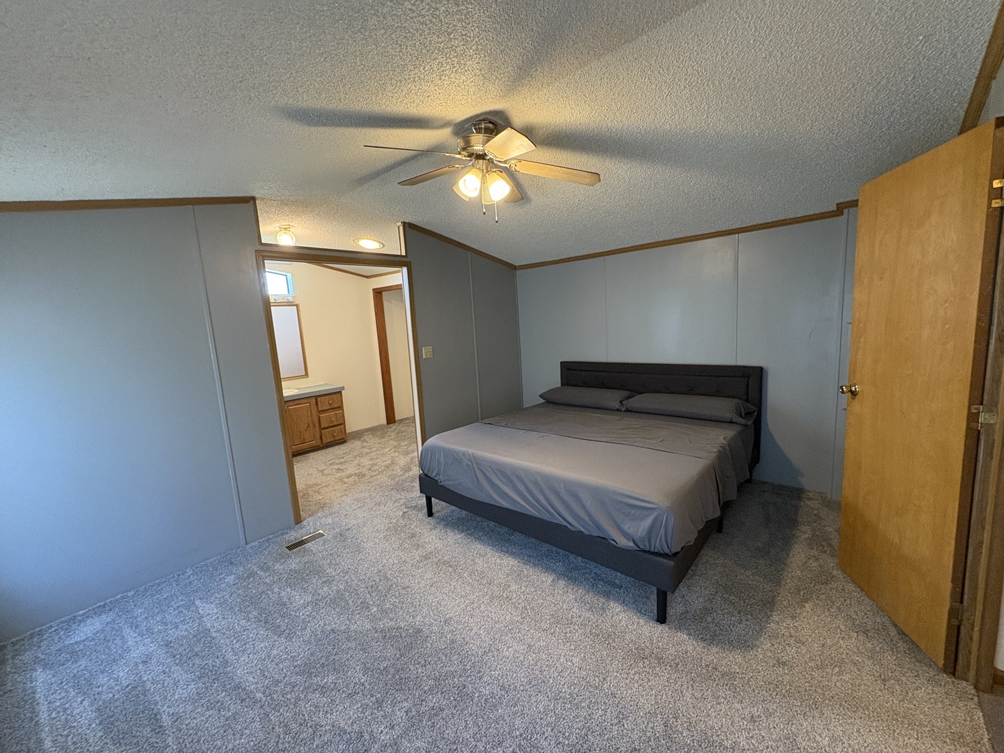 2211 Crestview Drive Princeton, IL 61356 - Photo 14 of 23 a spacious bedroom with a bed and a chandelier
