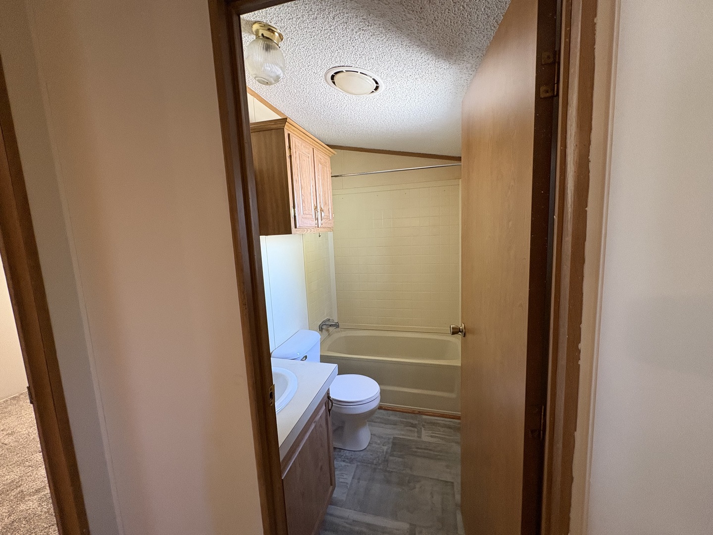 2211 Crestview Drive Princeton, IL 61356 - Photo 20 of 23 a bathroom with a granite countertop sink a toilet and a mirror