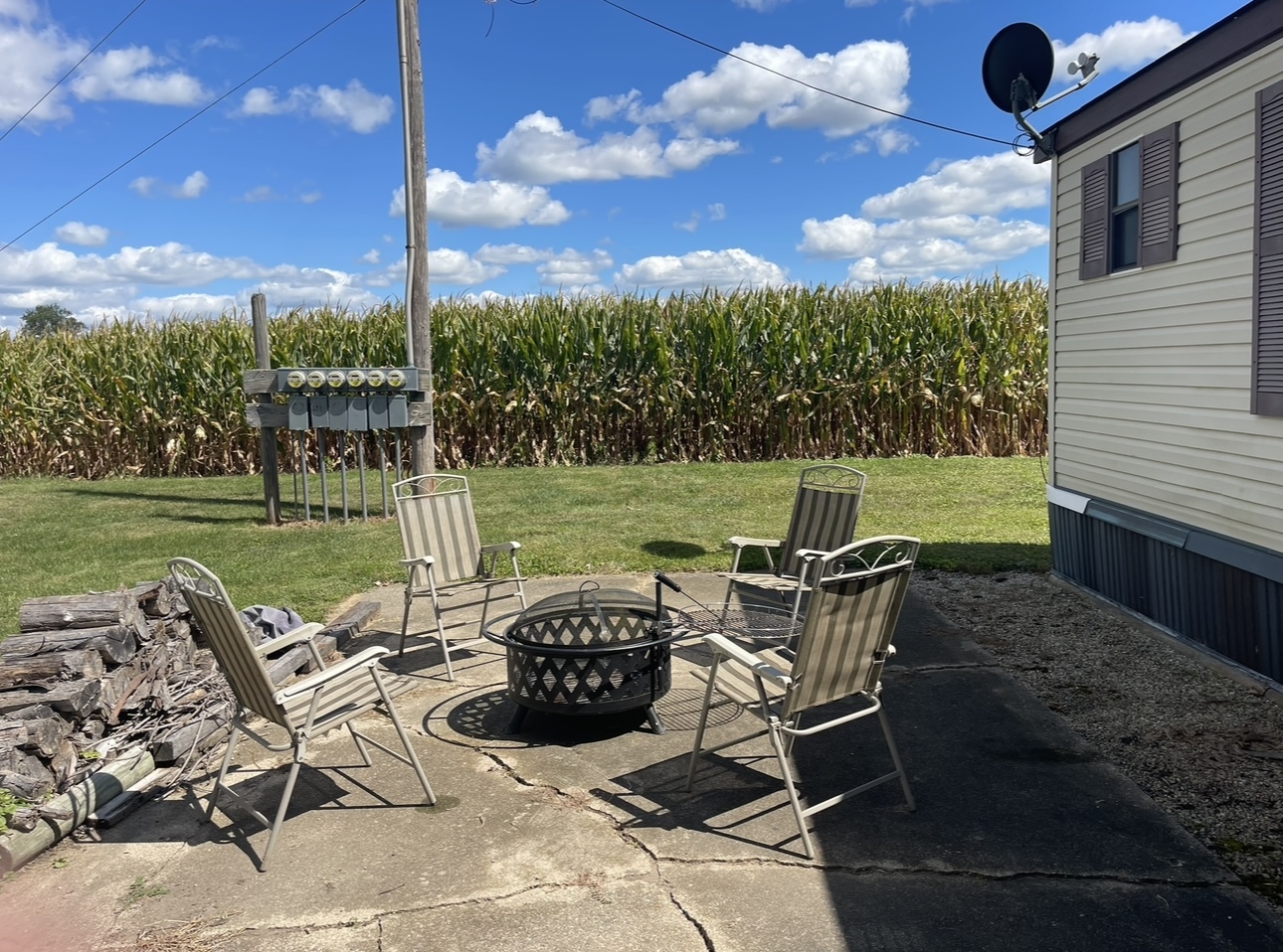 2211 Crestview Drive Princeton, IL 61356 - Photo 22 of 23 a view of a chairs and table in patio with a yard