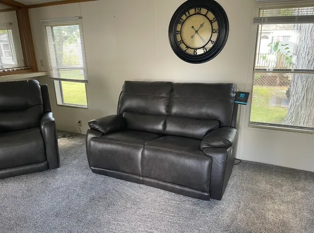 a living room with a couch and window