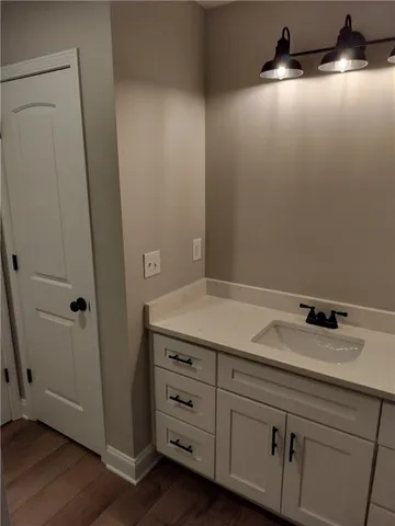 a room with cabinets and wooden floor