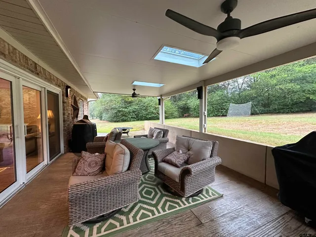 a balcony with furniture and a swing