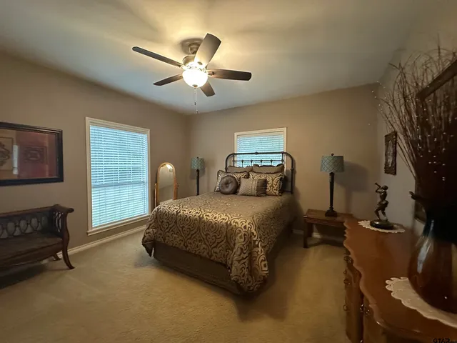 a bedroom with bed and window