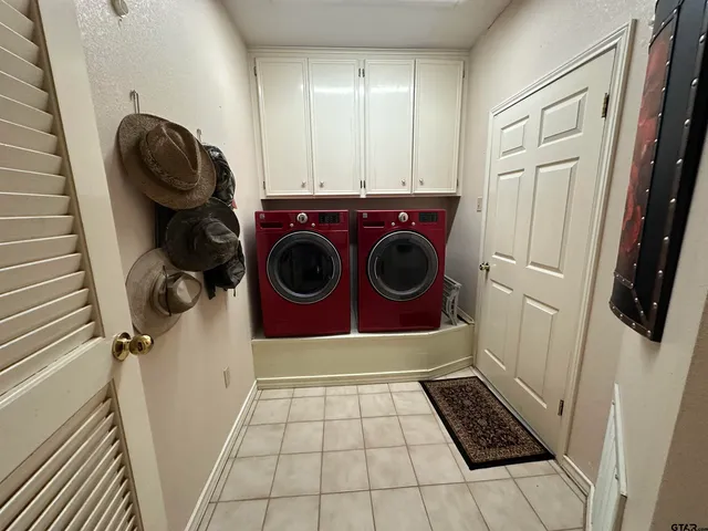 a utility room with dryer and washer