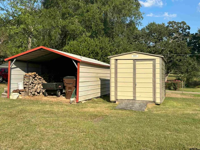 a view of backyard with barbeque grill and backyard