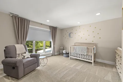 a bedroom with furniture and a window